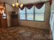 Dining room featuring natural light from a large window and neutral finishes throughout at 2461 Ridgecrest Dr, Stanley, NC 28164