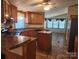 Open kitchen with a functional island and an adjoining dining area, perfect for entertaining and daily living at 2461 Ridgecrest Dr, Stanley, NC 28164