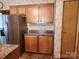 Kitchen featuring stainless steel appliances and wood cabinets, offering functionality and storage space at 2461 Ridgecrest Dr, Stanley, NC 28164