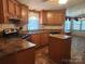 Functional kitchen with wooden cabinets, and a breakfast nook at 2461 Ridgecrest Dr, Stanley, NC 28164