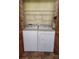 Laundry area with a washer and dryer, complemented by shelving for storage, enhancing functionality at 2461 Ridgecrest Dr, Stanley, NC 28164