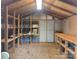 Interior of a backyard storage shed with built-in shelving and a workbench at 2461 Ridgecrest Dr, Stanley, NC 28164