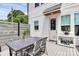 Back deck with a table and seating surrounded by a privacy fence, offering outdoor dining space at 2600 Palm Ave, Charlotte, NC 28205
