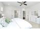 Well-lit bedroom featuring hardwood floors, bright white walls, and walk in closets at 2600 Palm Ave, Charlotte, NC 28205