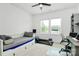 Bright bedroom featuring a day bed, gray desk, and lots of natural light at 2600 Palm Ave, Charlotte, NC 28205