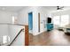 Hallway landing with hardwood flooring, staircase, and views of the living room at 2600 Palm Ave, Charlotte, NC 28205