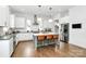 Modern kitchen featuring stainless steel appliances, a large island with seating, and ample counter space for cooking at 2600 Palm Ave, Charlotte, NC 28205