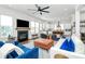 Spacious living room with fireplace, large windows, and open layout to kitchen and bar for seamless entertaining at 2600 Palm Ave, Charlotte, NC 28205