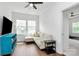 Bright living room featuring a comfortable sofa, large windows, and modern decor at 2600 Palm Ave, Charlotte, NC 28205