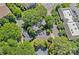 Aerial view of neighborhood featuring tree-lined streets and nearby shopping and business area at 2625 E 5Th St # F, Charlotte, NC 28204