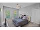 Cozy bedroom with carpet, a ceiling fan, and a window with natural light at 2625 E 5Th St # F, Charlotte, NC 28204