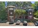 Apartment building with mature trees, well-maintained landscaping, and dedicated parking spaces at 2625 E 5Th St # F, Charlotte, NC 28204