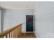 Charming entrance features a vibrant wreath and light blue siding at 2625 E 5Th St # F, Charlotte, NC 28204