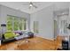 Bright living room featuring large windows, hardwood floors, and ample natural light at 2625 E 5Th St # F, Charlotte, NC 28204