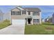Charming two-story home with a well-manicured lawn and a two-car garage in a suburban neighborhood at 2629 Goose Fair Rd # 61, Maiden, NC 28650