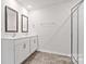 A modern bathroom with double vanity, framed mirrors, shower and sleek fixtures at 2656 Goose Fair Rd # 126, Maiden, NC 28650