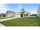 Well-maintained home featuring an attached garage and a neatly landscaped front yard with green grass at 2656 Goose Fair Rd # 126, Maiden, NC 28650