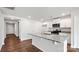 Modern kitchen featuring granite countertops, white cabinetry, stainless steel appliances, and an island with a sink at 2656 Goose Fair Rd # 126, Maiden, NC 28650