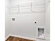 Functional laundry room with wire shelving, utility connections, and wood-look flooring for added convenience at 2656 Goose Fair Rd # 126, Maiden, NC 28650