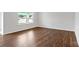 This living room has sleek hardwood flooring and natural light from a large window at 2656 Goose Fair Rd # 126, Maiden, NC 28650