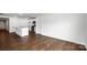 Bright living room featuring dark wood floors, white kitchen cabinets, and an open floor plan at 2656 Goose Fair Rd # 126, Maiden, NC 28650