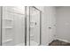 Bright bathroom showcasing a glass-enclosed shower with built-in shelves and a tiled surround at 2656 Goose Fair Rd # 126, Maiden, NC 28650