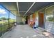 Covered back porch offers an inviting outdoor space for seating and relaxation with brick and concrete at 2722 Catawba Church Rd, Rock Hill, SC 29730