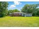 Expansive backyard with lush green lawn and the rear exterior of the home at 2722 Catawba Church Rd, Rock Hill, SC 29730
