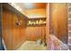 Basement storage featuring wood paneling, shelving, and concrete flooring at 2722 Catawba Church Rd, Rock Hill, SC 29730