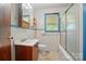 Tiled bathroom with blue trim, a window, vanity, and shower-tub combination at 2722 Catawba Church Rd, Rock Hill, SC 29730