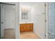 Bathroom featuring a vanity with oak cabinets and access to adjacent rooms at 2722 Catawba Church Rd, Rock Hill, SC 29730