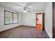 Neutral bedroom featuring a ceiling fan, window, patterned floor, and doorway at 2722 Catawba Church Rd, Rock Hill, SC 29730
