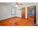 Bedroom featuring hardwood floors, a ceiling fan, and trim around the window at 2722 Catawba Church Rd, Rock Hill, SC 29730