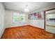 Cozy dining area with hardwood floors, glass-front cabinets, and views into the kitchen, adjacent to the living area at 2722 Catawba Church Rd, Rock Hill, SC 29730