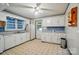 Functional kitchen featuring white cabinets, vintage flooring, and a bright window, perfect for practical home cooks at 2722 Catawba Church Rd, Rock Hill, SC 29730