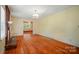 Open living room with hardwood floors, brick fireplace, and light-filled windows providing ample natural light at 2722 Catawba Church Rd, Rock Hill, SC 29730
