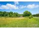 Lush yard with mature trees, creating a serene and private outdoor space at 2722 Catawba Church Rd, Rock Hill, SC 29730