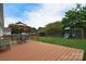 Expansive backyard featuring a spacious wooden deck, outdoor seating, and a playset, perfect for entertaining at 2836 Rosemeade Dr, Monroe, NC 28110