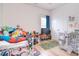 Playful bedroom with lots of toys has ample storage and closet space at 2836 Rosemeade Dr, Monroe, NC 28110