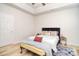 Bright bedroom with tray ceilings features a modern bed and neutral walls at 2836 Rosemeade Dr, Monroe, NC 28110