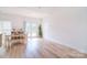 Inviting dining area adjacent to the living room with French doors to the backyard at 2836 Rosemeade Dr, Monroe, NC 28110