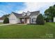 Well-maintained single Gathering home featuring an attached garage, manicured lawn and inviting entryway at 2836 Rosemeade Dr, Monroe, NC 28110