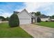Charming home with a two-car garage, well-manicured lawn, and inviting curb appeal in a quiet neighborhood at 2836 Rosemeade Dr, Monroe, NC 28110