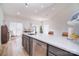Spacious kitchen island with a sink and sleek, stainless steel dishwasher at 2836 Rosemeade Dr, Monroe, NC 28110
