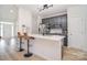 Modern kitchen featuring sleek countertops with barstool seating, stainless steel appliances, and ample cabinet space at 2836 Rosemeade Dr, Monroe, NC 28110
