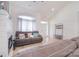 Cozy living area with a fireplace, large windows, hardwood floors, and comfortable seating at 2836 Rosemeade Dr, Monroe, NC 28110