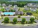Community aerial view featuring a clubhouse, pool, playground, parking, and green spaces at 3255 Split Rail Ln, Lancaster, SC 29720