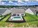 Aerial shot of a home with a fenced backyard, a pristine pool, and a cozy patio area at 3255 Split Rail Ln, Lancaster, SC 29720