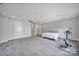 A large bedroom with gray carpet, a double bed, and exercise equipment at 3255 Split Rail Ln, Lancaster, SC 29720