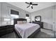 Bedroom with a dark wood bed frame and matching furniture, windows with blinds, and neutral-colored walls at 3255 Split Rail Ln, Lancaster, SC 29720